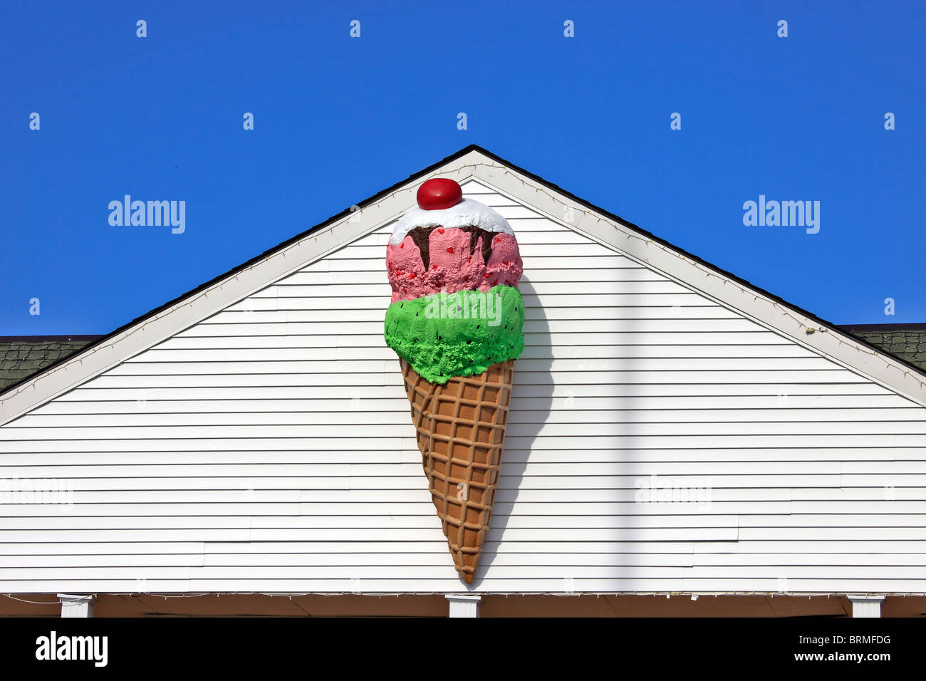 Ice cream cone figure above ice cream shop, Port jefferson Village