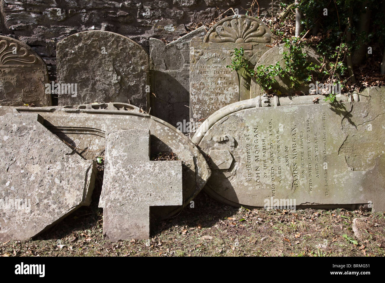 Gravestones removed from churchyard and stacked at side Talgarth Wales