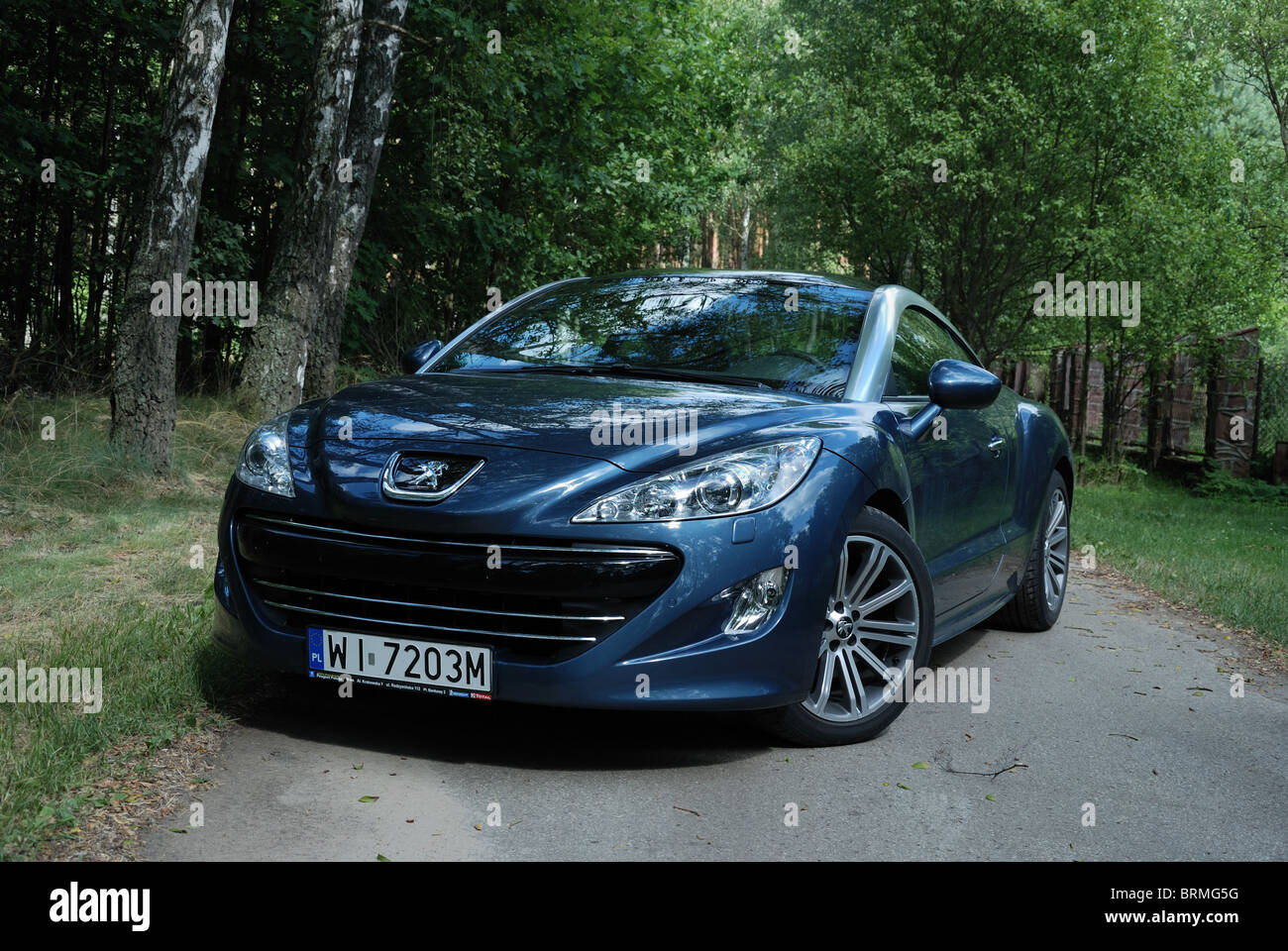 Peugeot RCZ  HDi - MY 2010 - blue metallic - French popular compact  coupe, sports car - in a park Stock Photo - Alamy