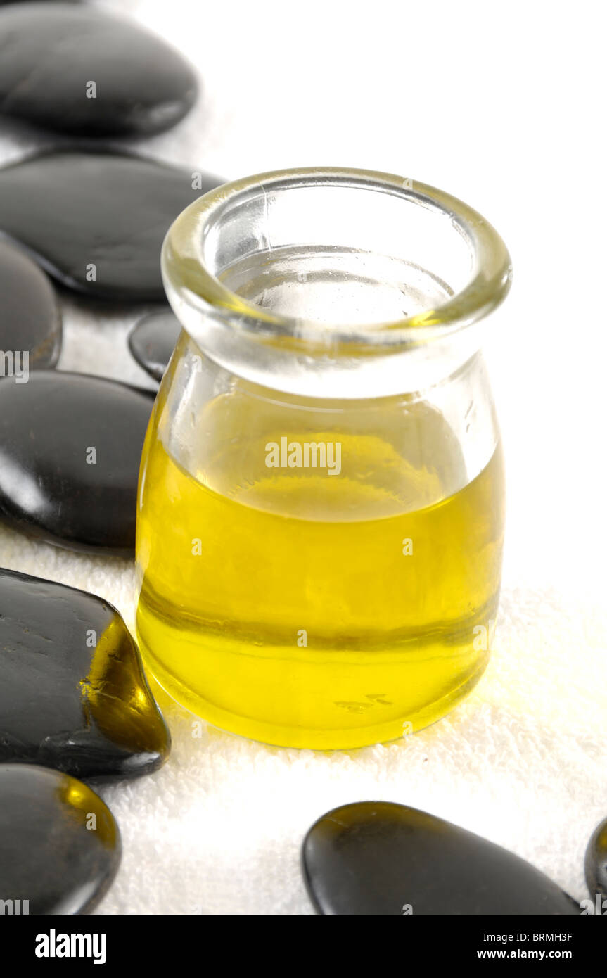 Massage oil bottle near pebbles Stock Photo Alamy