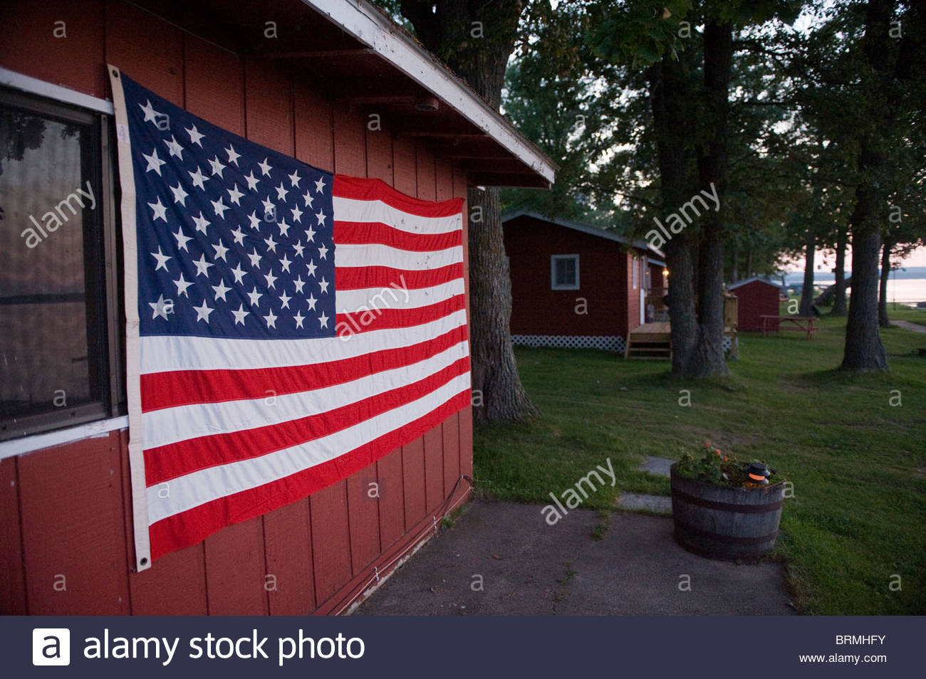 The American Flag Is Hung On A Cabin At Leech Lake Mn Stock Photo