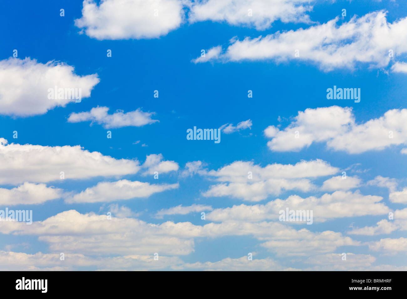 blue sky with white fluffy clouds background Stock Photo - Alamy