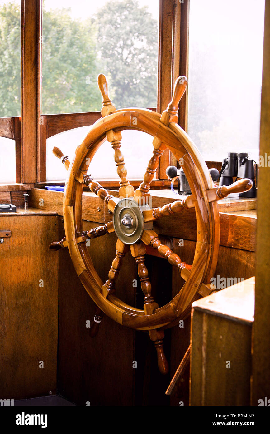 a wooden Captain’s wheel on an old riverboat Stock Photo - Alamy