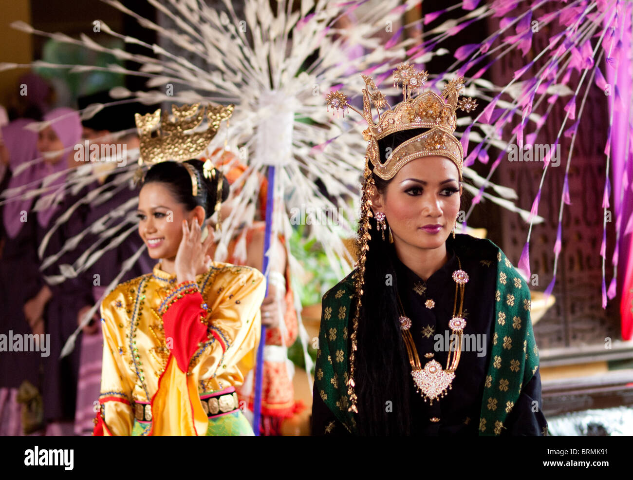 Beautiful and gorgeous Malaysian girls, in traditional and colourful Malay dress. Stock Photo
