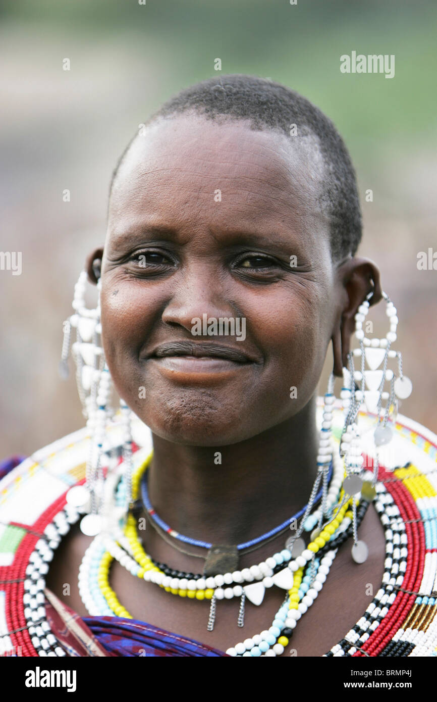 Portrait of a Maasai woman wearing traditional bead and earrings Stock Photo