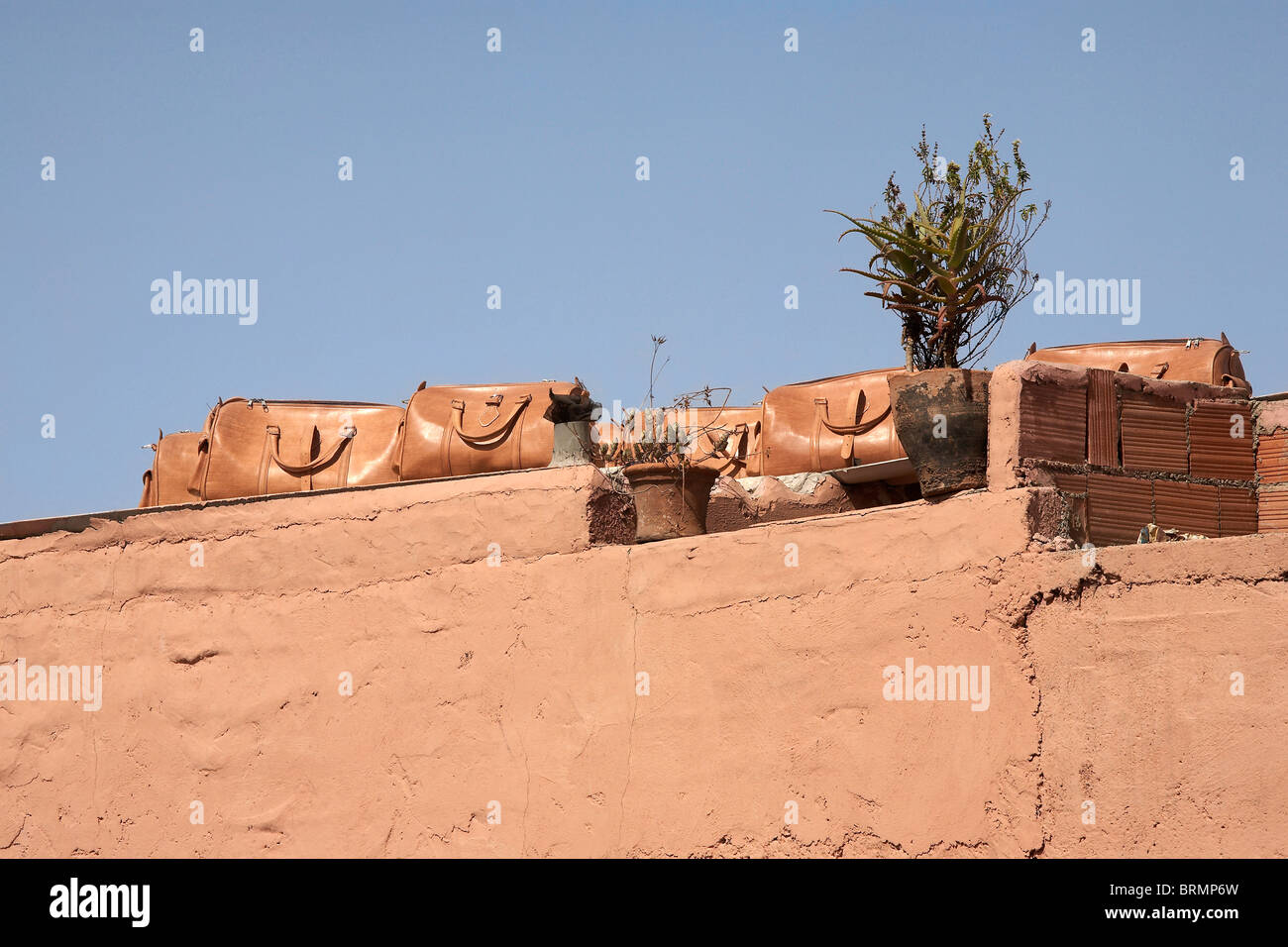 MARRAKESH: LEATHER BAGS ON DISPLAY ON ROOFTOP Stock Photo