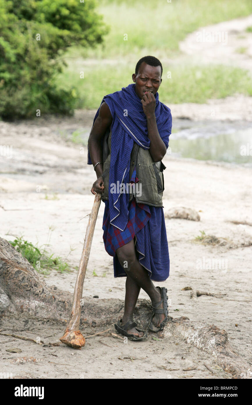 Maasai men wearing the traditional shuka and carrying spears Stock