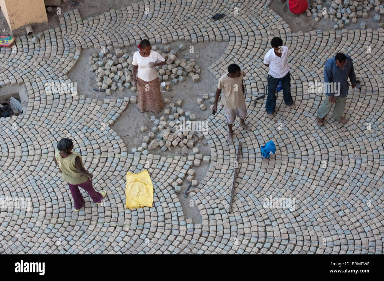 Overhead view of a supervisor inspecting a freshly laid pavement Stock Photo