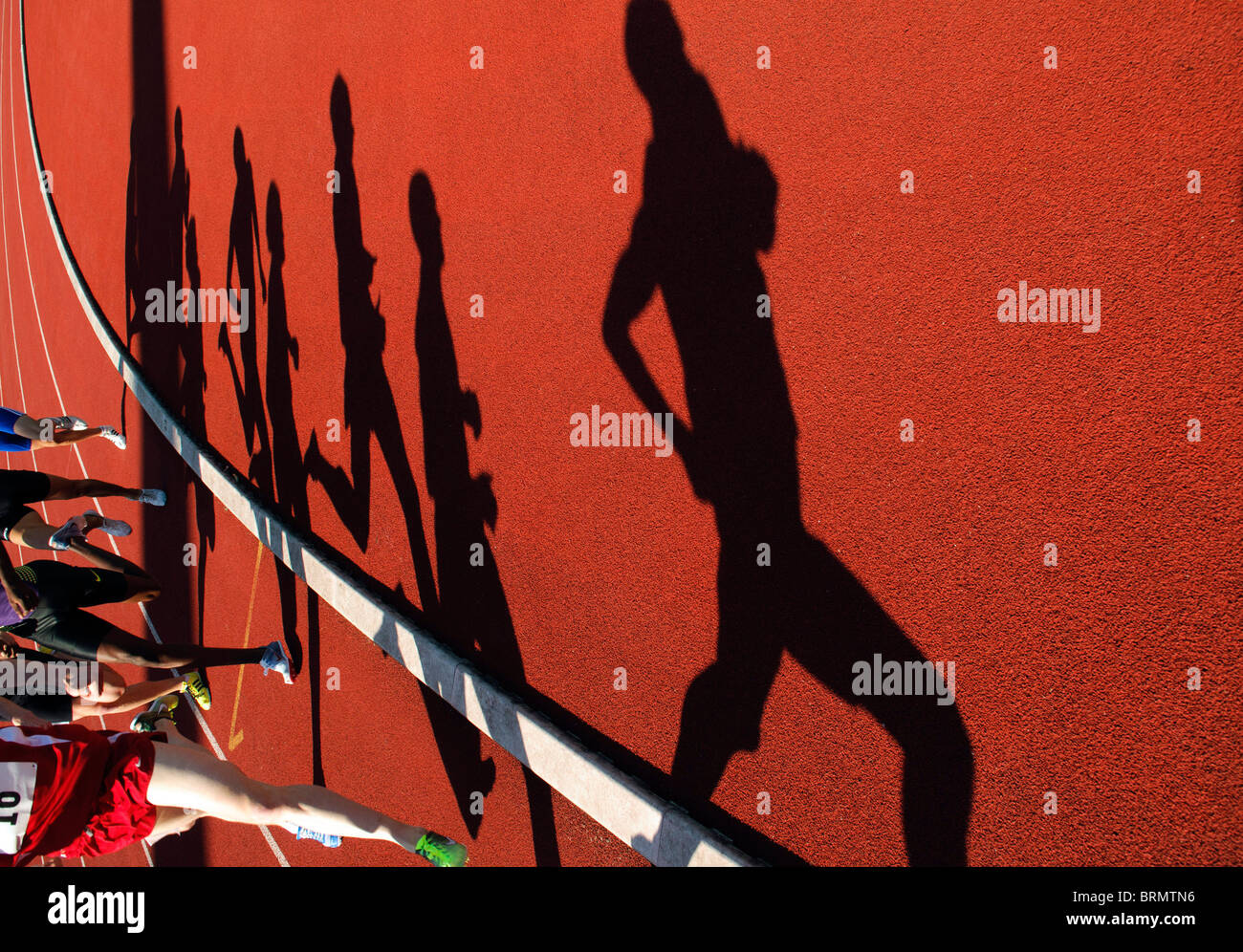 shadows of runners during 800m race during outdoor track and field