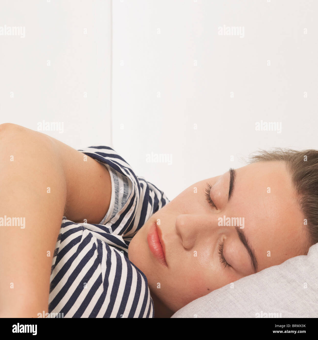 Woman reclined with eyes closed Stock Photo