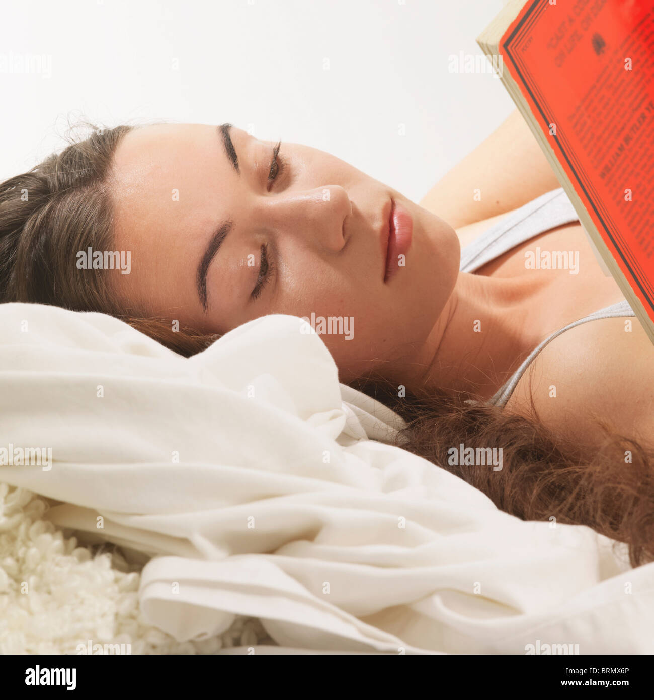 Woman reclined reading book Stock Photo