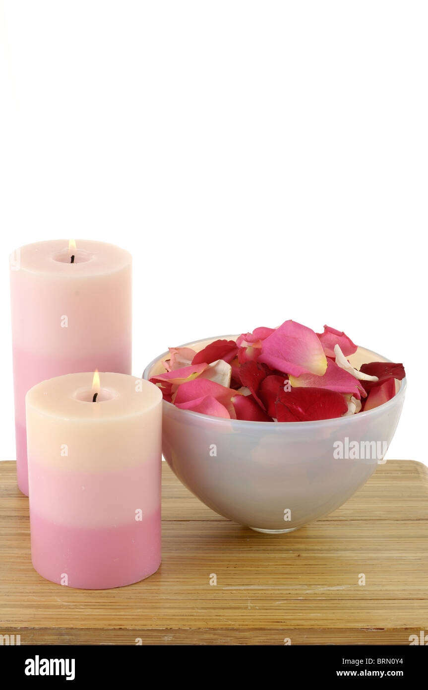Candles lit up near rose petals in a bowl Stock Photo - Alamy