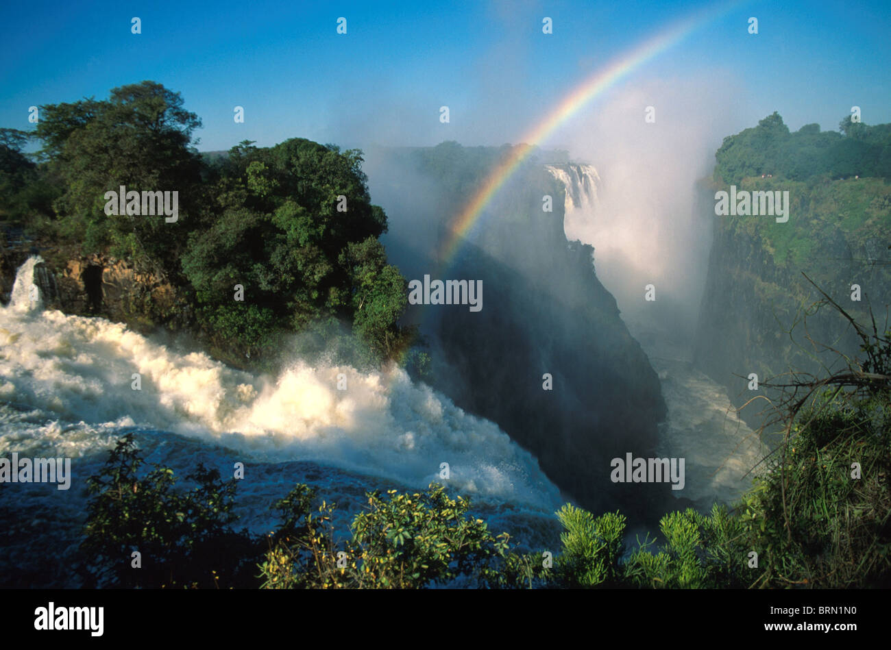 Part of the main falls of the Victoria Falls showing a rainbow Stock Photo