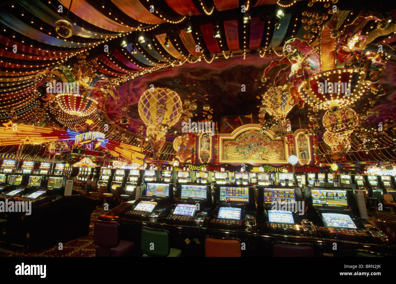 The interior of the Carnival City Casino showing slot machines and glitzy dΘcor near Johannesburg ca. year 2001 Stock Photo