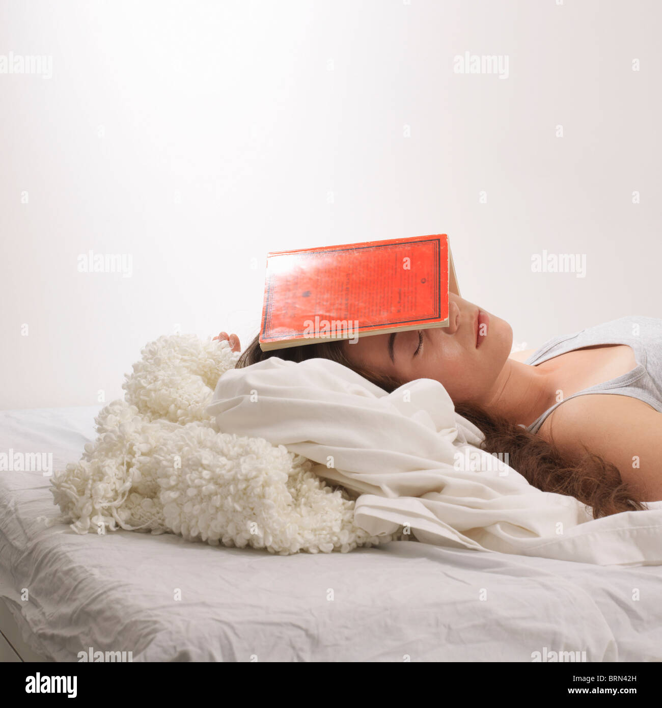Woman with book on her head Stock Photo