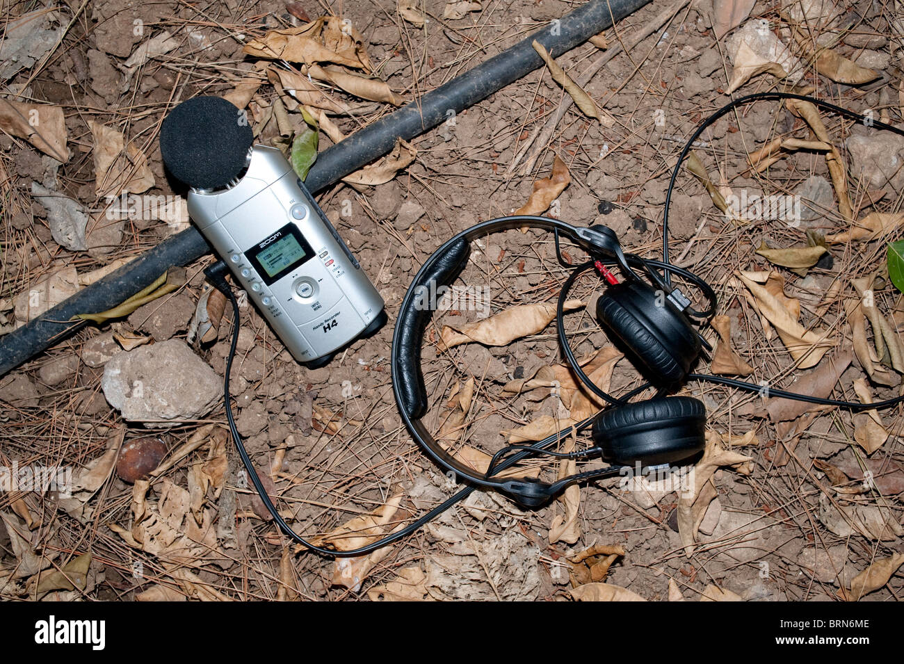 Zoom H4 digital audio recorder and headphones on location Stock Photo