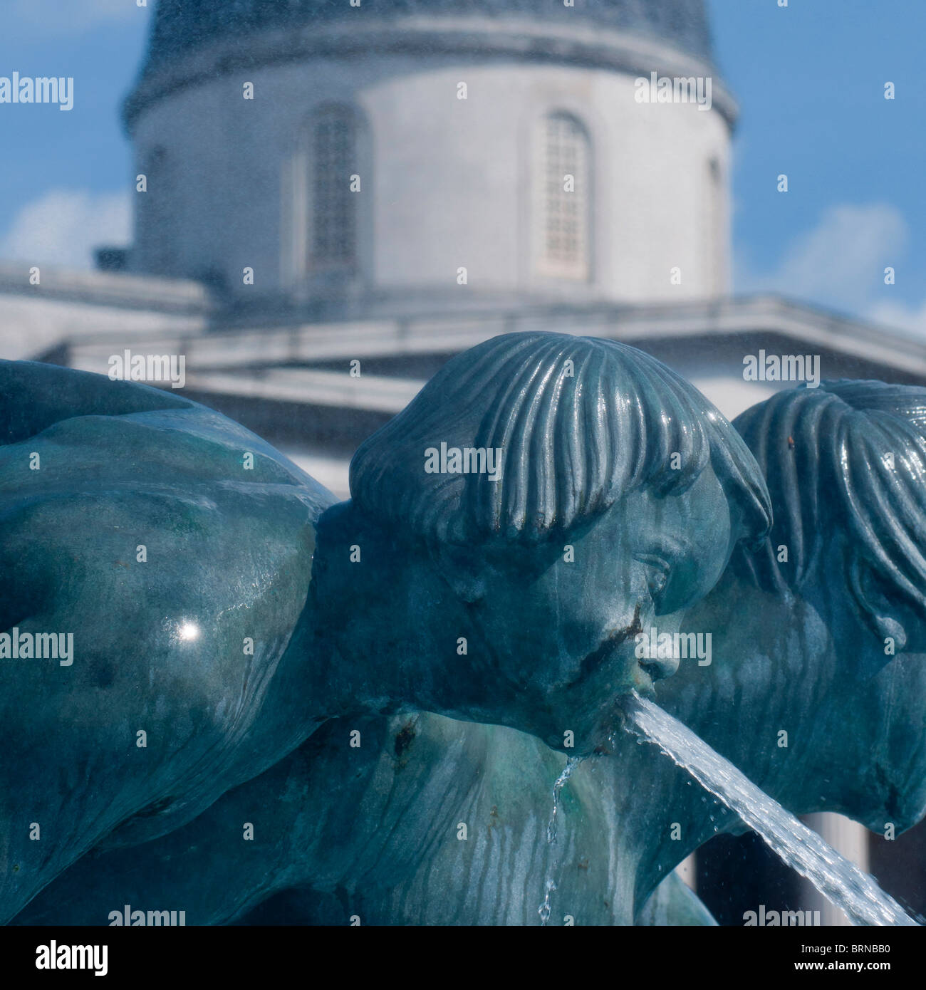 Trafalgar Square fountain with the National Gallery in the background Stock Photo