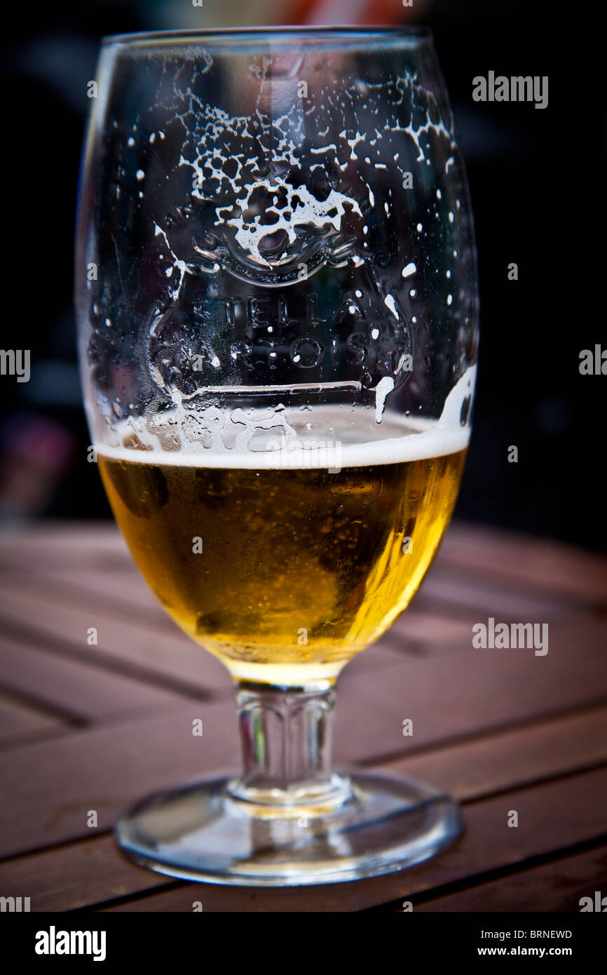 half drunk pint of lager Stock Photo Alamy
