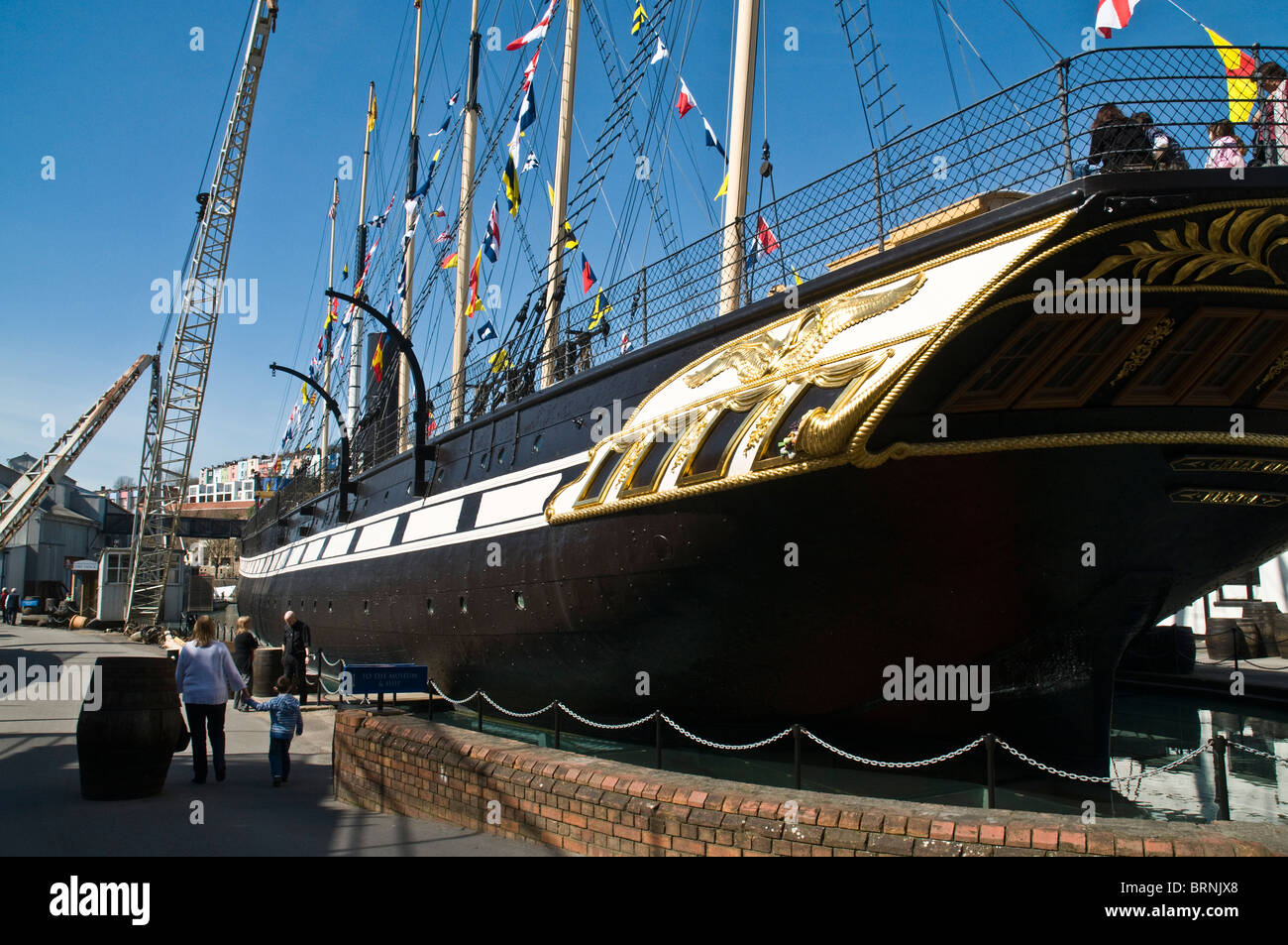 dh SS Great Britain BRISTOL DOCKS BRISTOL Brunels SS Great Britain museum dockside woman and child tourists steamship ship people uk Stock Photo