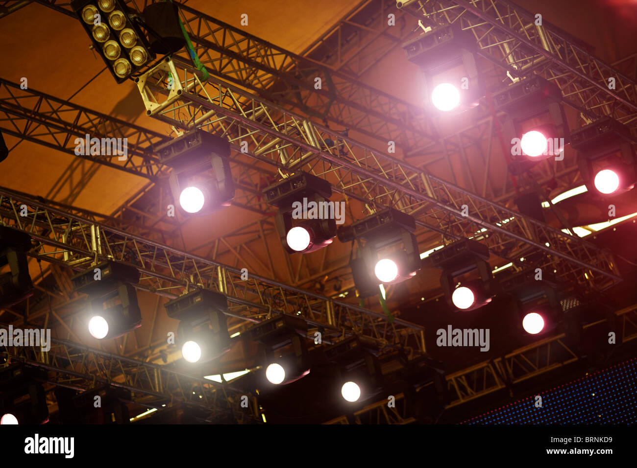 a stage light rack with spotlights shining down ,selective focus Stock