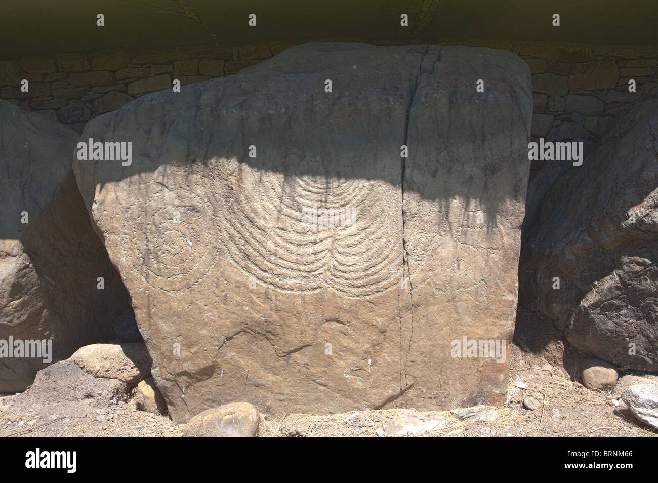 Megalithic stone surrounding main mound, Knowth neolithic passage grave, Boyne Valley, Ireland Stock Photo