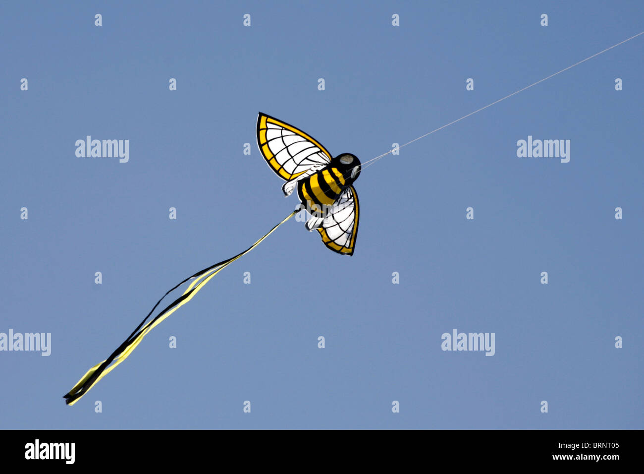 bumble bee kite shape flight flying blue sky toy Stock Photo