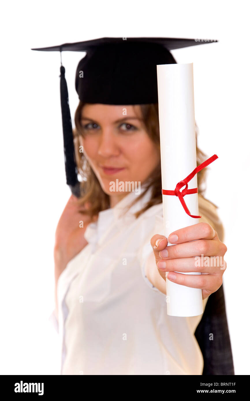 Young woman with graduation diploma and graduation hat isolated on white, diploma on a first scene, blurry women inn background Stock Photo