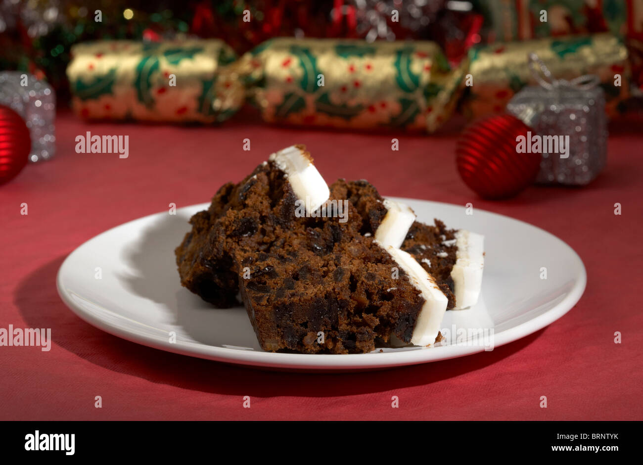 slices of iced christmas fruit cake left out for santa Stock Photo