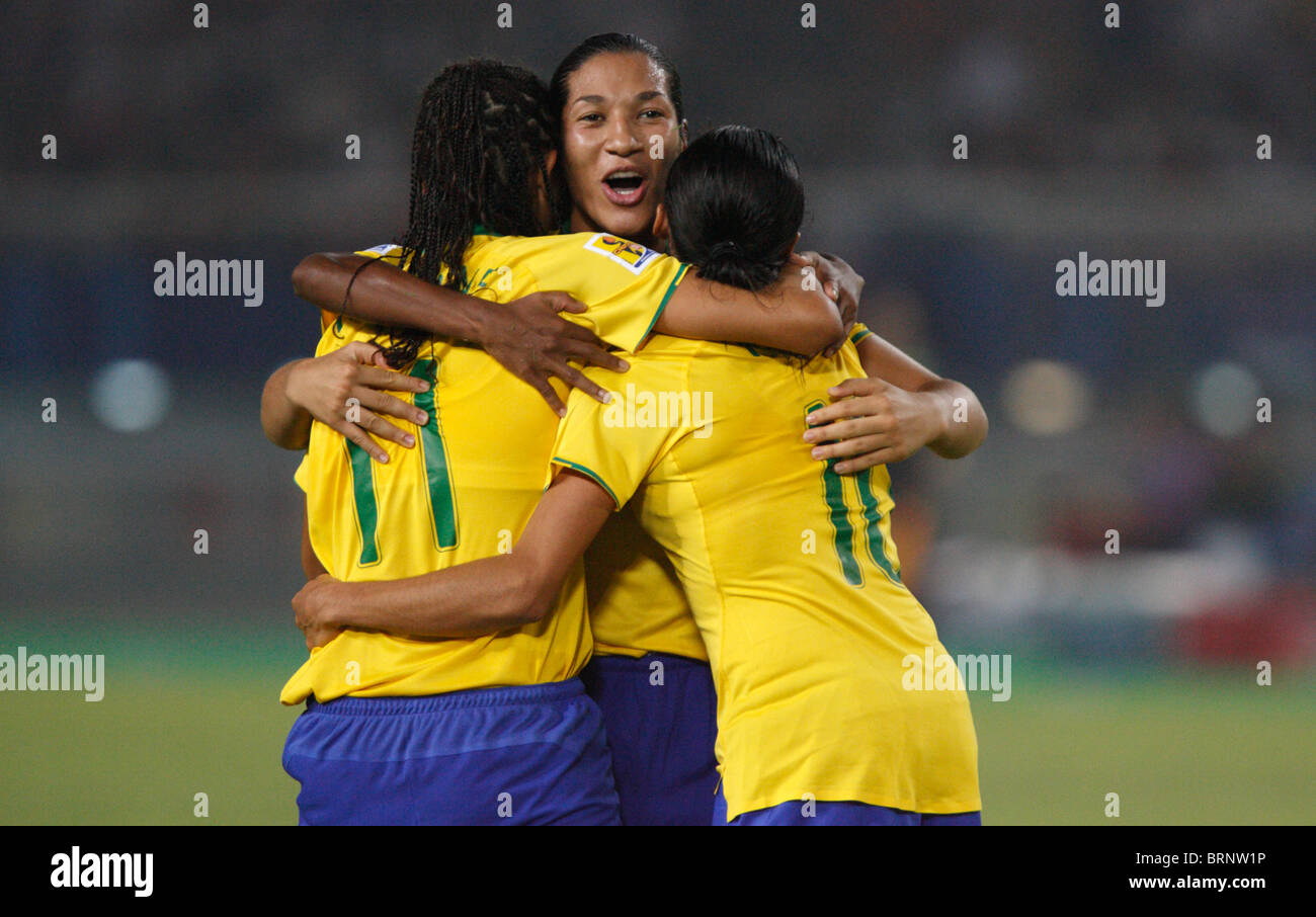 Cristiane, Daniela and Marta (l-r) of Brazil celebrate after a goal against China during a 2007 Women's World Cup soccer match. Stock Photo