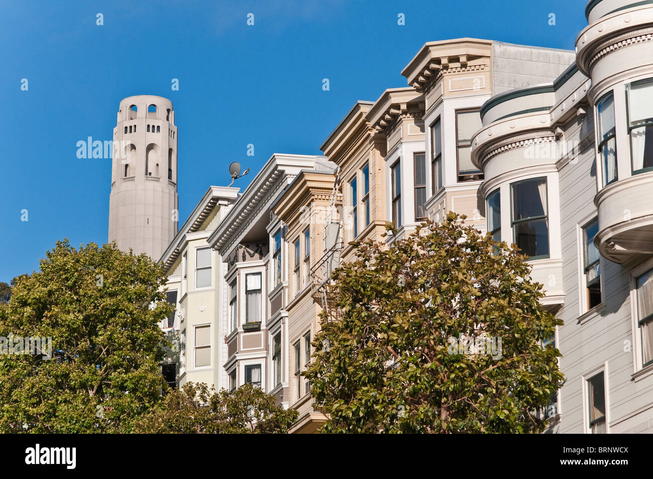 Victorian houses in front of Coit Tower, and observation tower, San Francisco, California, USA Stock Photo