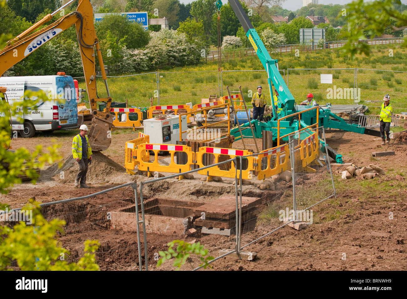 Contractors fix large burst water pipe UK Stock Photo Alamy