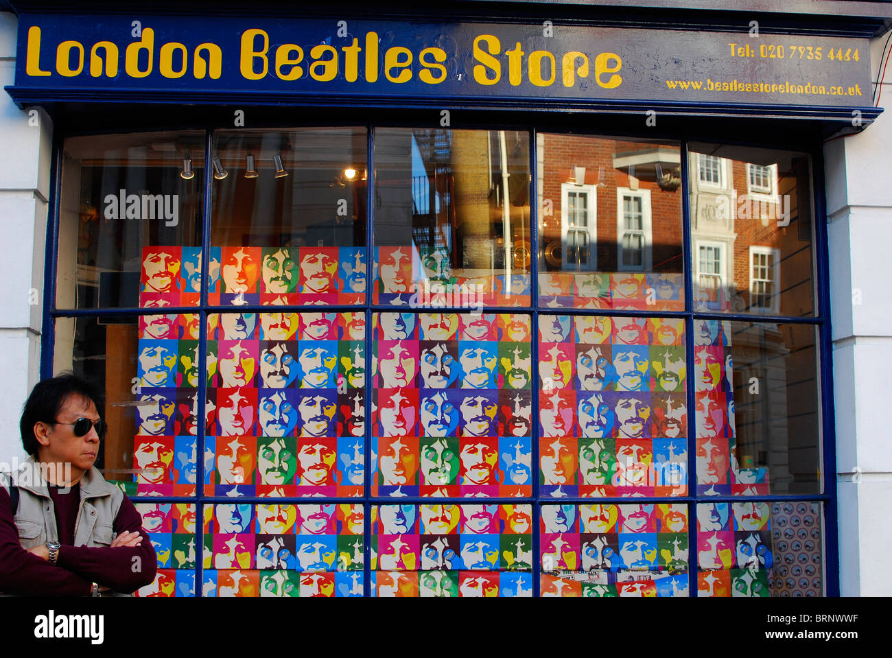 Tourist outside Beatles Store on Baker street, London Stock Photo
