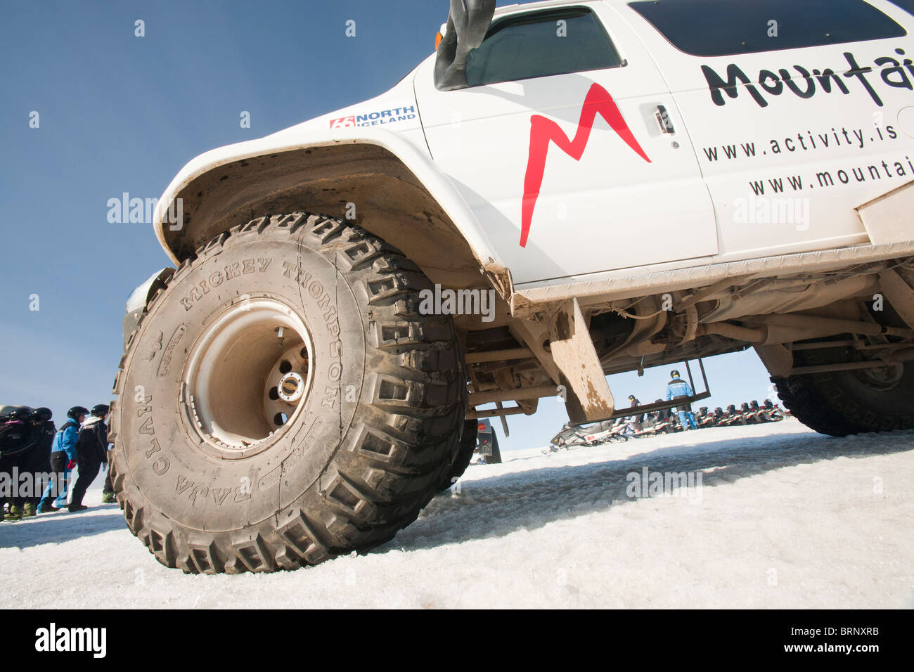 A tour guides massive four wheel drive on the Langjokull ice sheet in