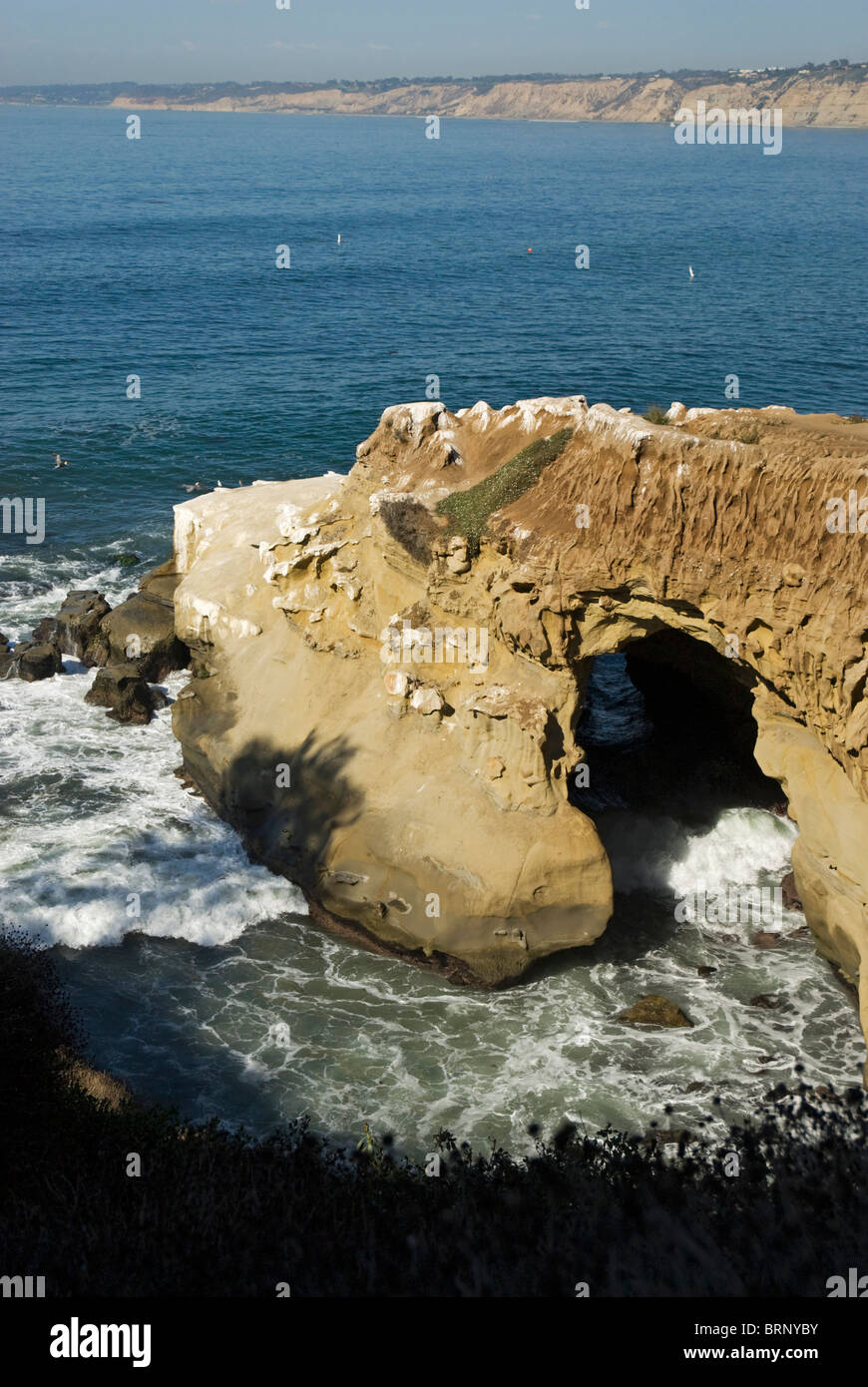 A sea cave, as seen looking over a cliff at La Jolla, California, USA Stock Photo