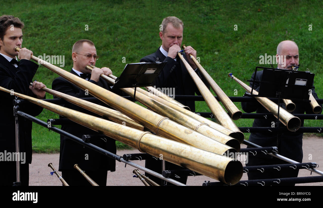 A band playing single tone brass horns entertains visitors at Peterhof