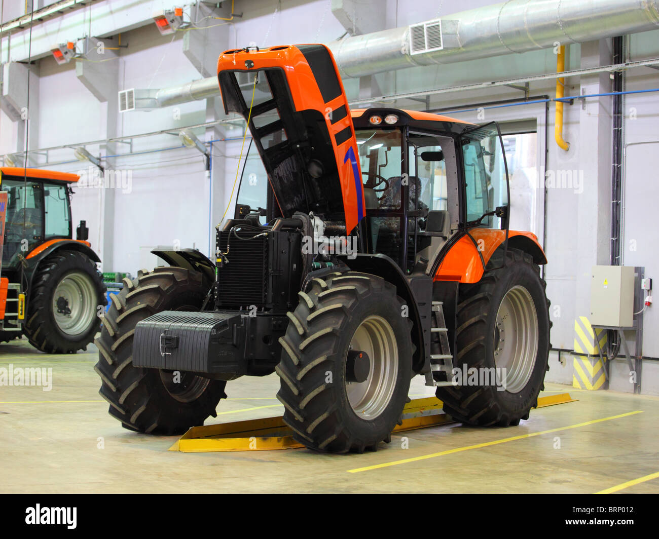 Assemblage of tractors on enterprise building berths in the European Union Stock Photo