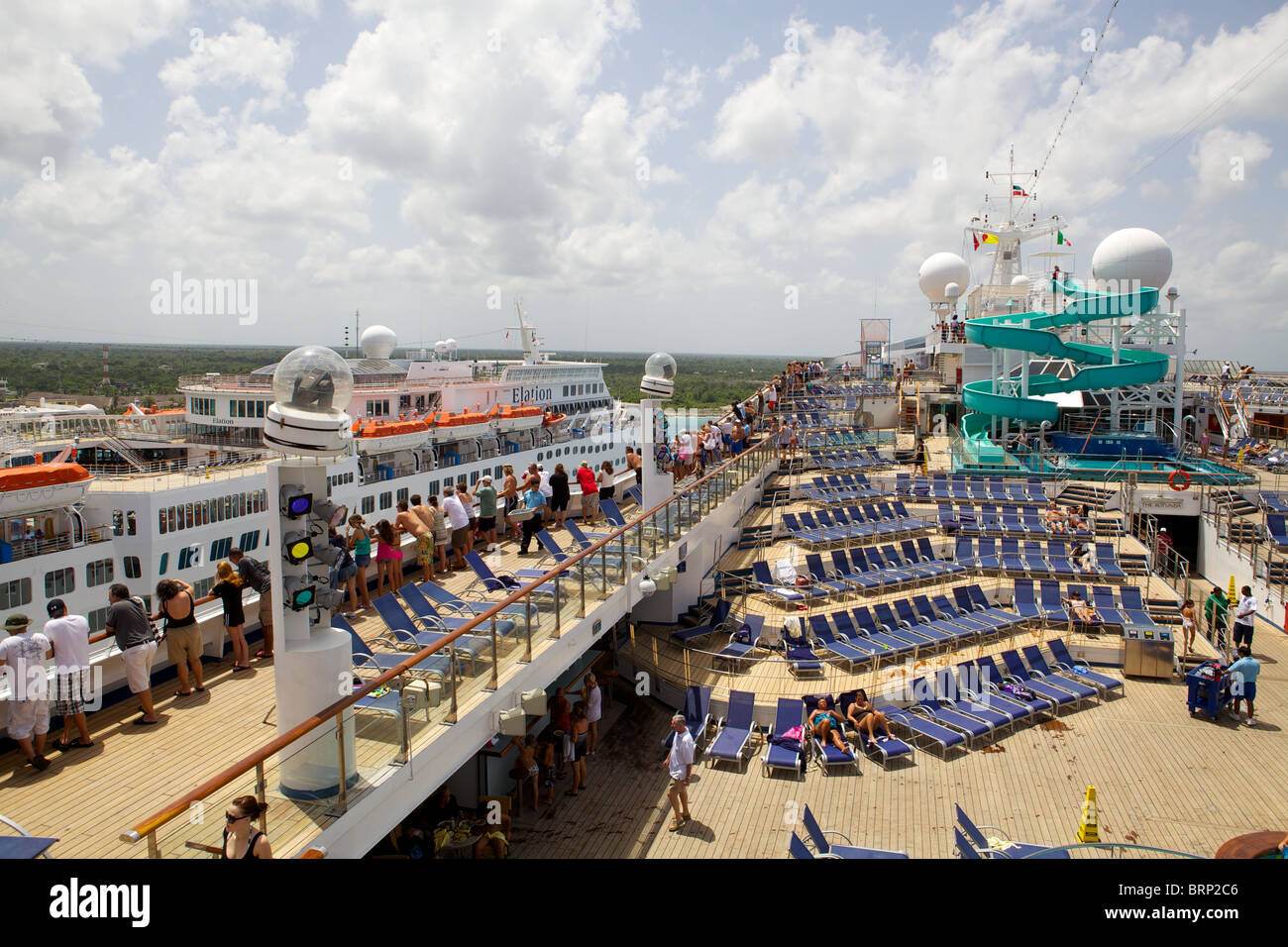 The top deck of the Carnival Destiny cruise ship, seen while docked in Cozumel, Mexico, adjacent to another cruise ship Stock Photo