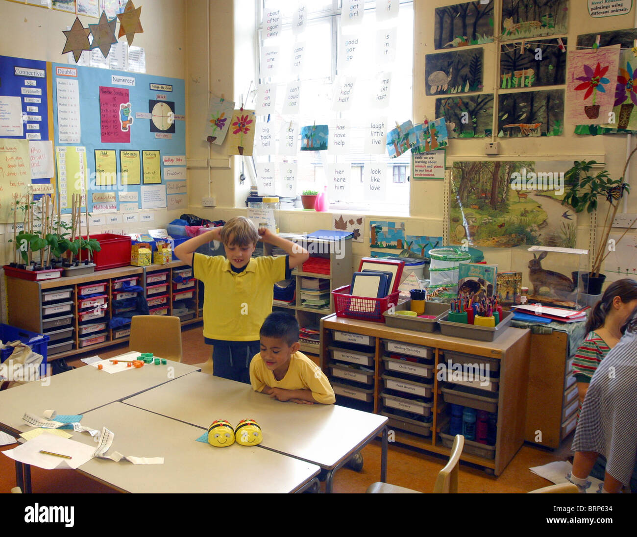 Primary Classroom Scene Showing Artwork Desks Storage Drawers And