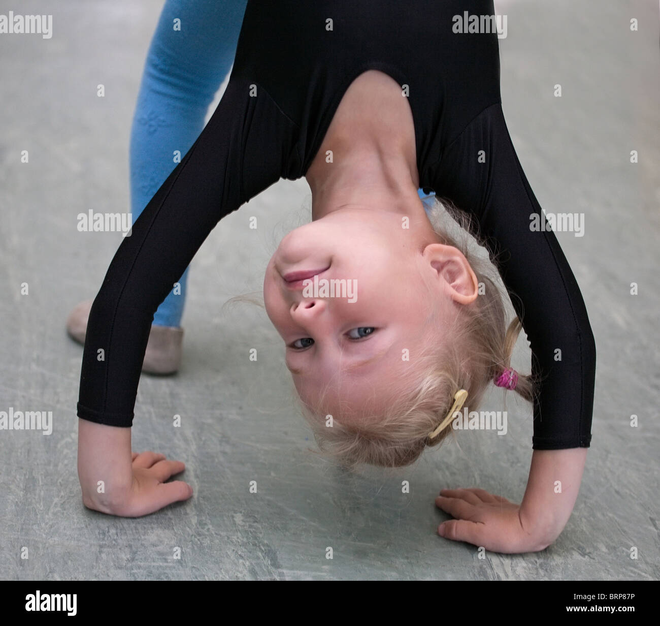 closeup of little gymnast girl doing exercises Stock Photo Alamy