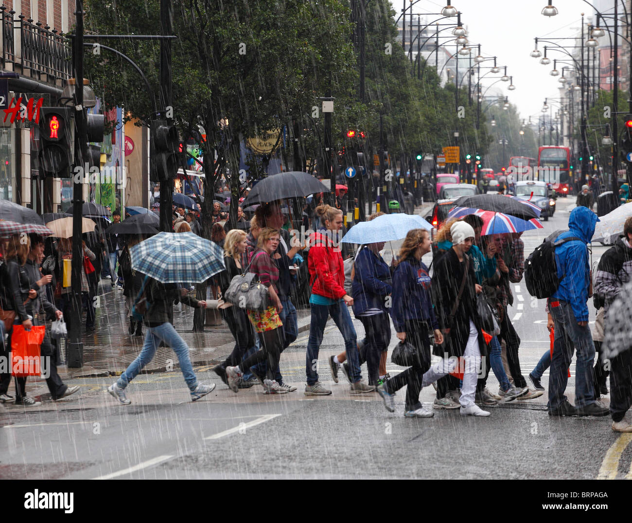 Oxford Street Shoppers on a cold and rainy day. Stock Photo