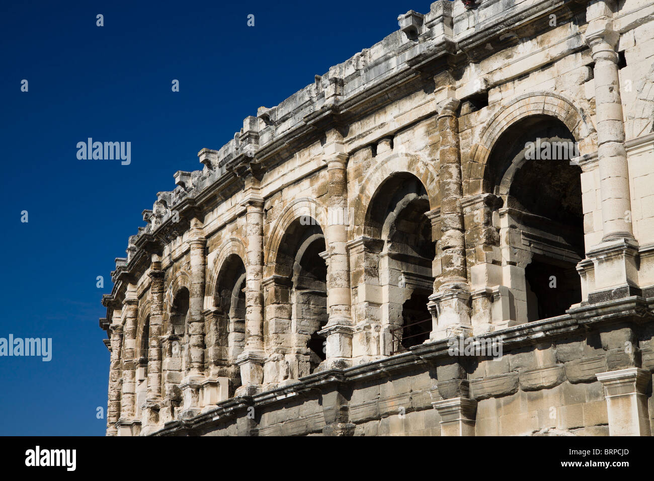 Les Arènes de Nîmes, a Roman arena in the city of Nimes in the south of France Stock Photo