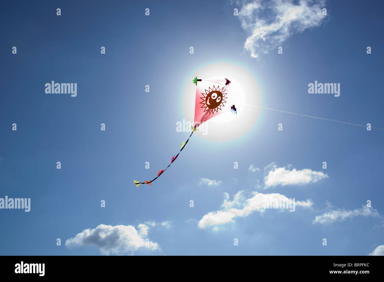 Kite in front of the sun Stock Photo