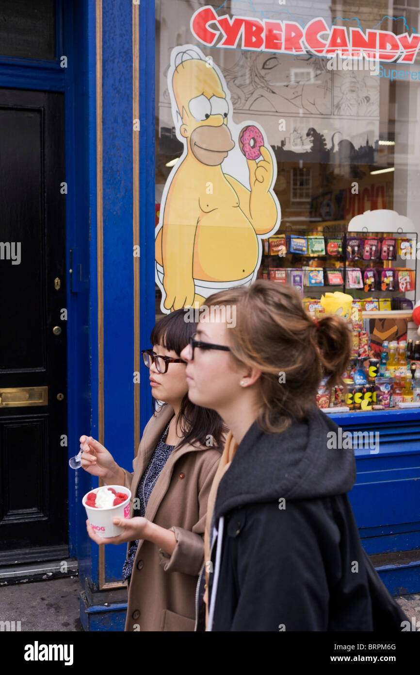 Homer Simpson cartoon character and women passersby holding ice cream