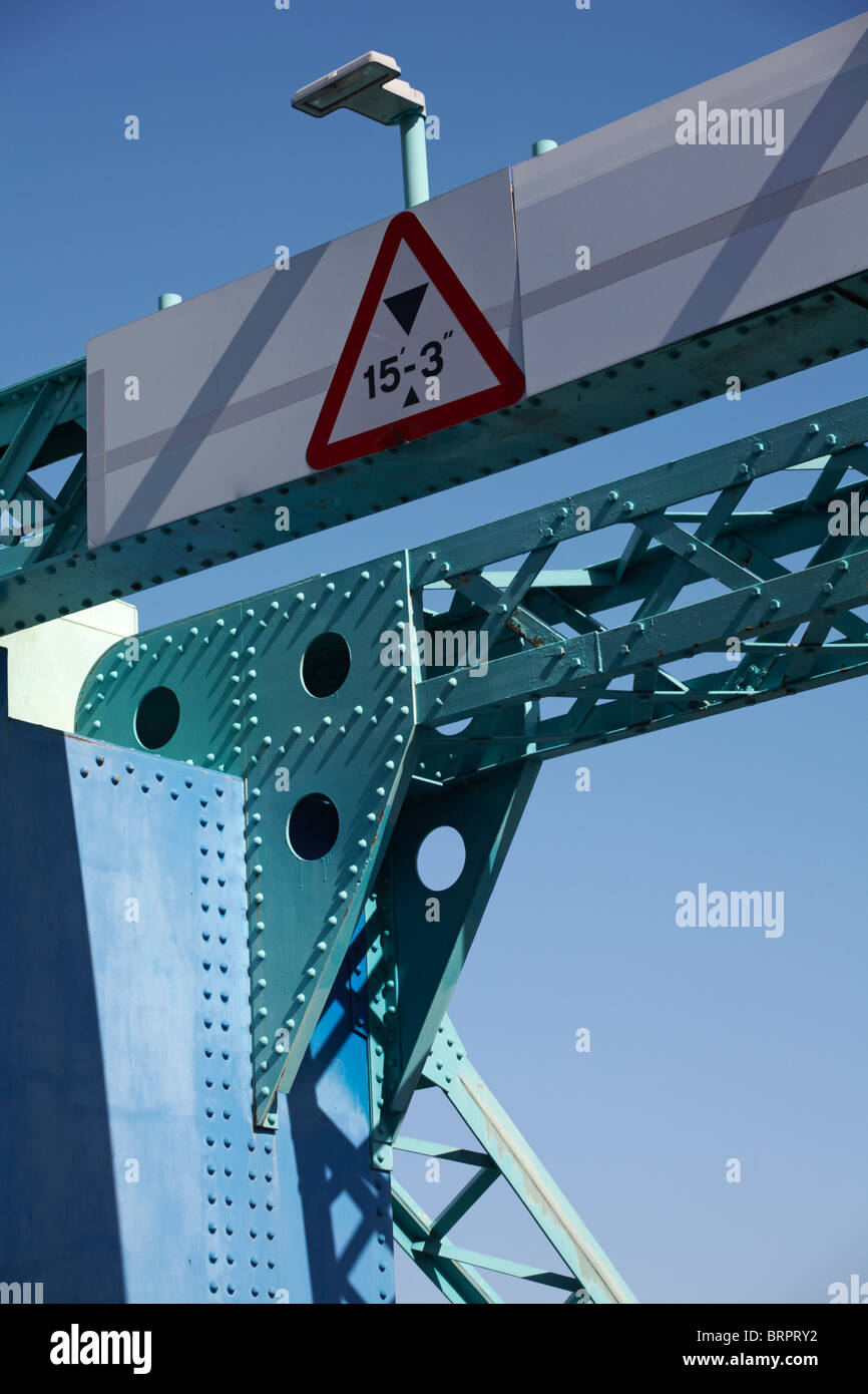 Height restriction sign 15'-3' on Poole lifting bridge, Dorset set against blue sky Stock Photo