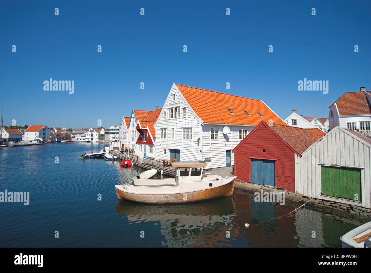 Skudeneshavn. Boathouse, wooden houses. Stock Photo