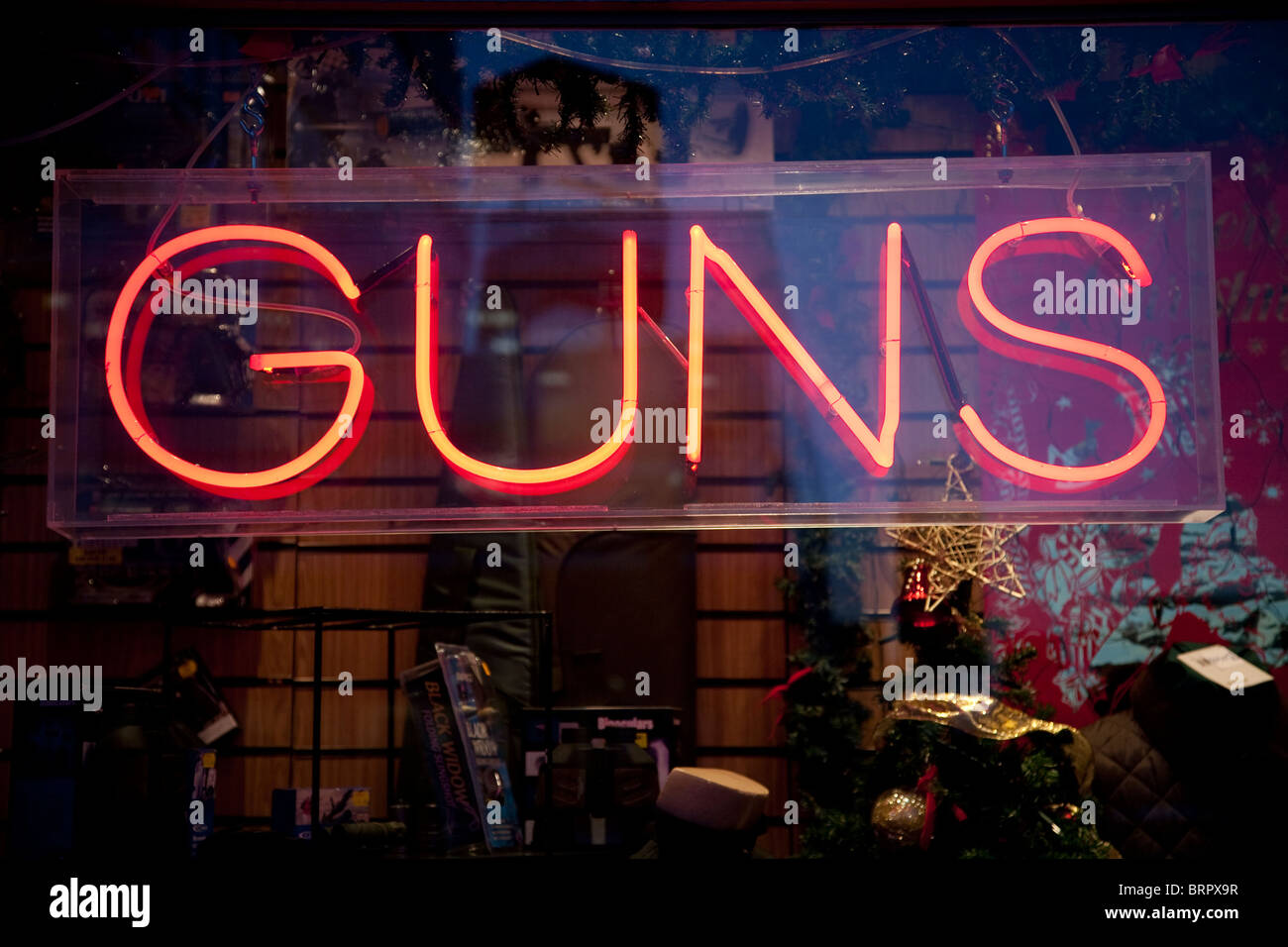 Shop window sign advertising guns for sale. Photo:Jeff Gilbert Stock Photo