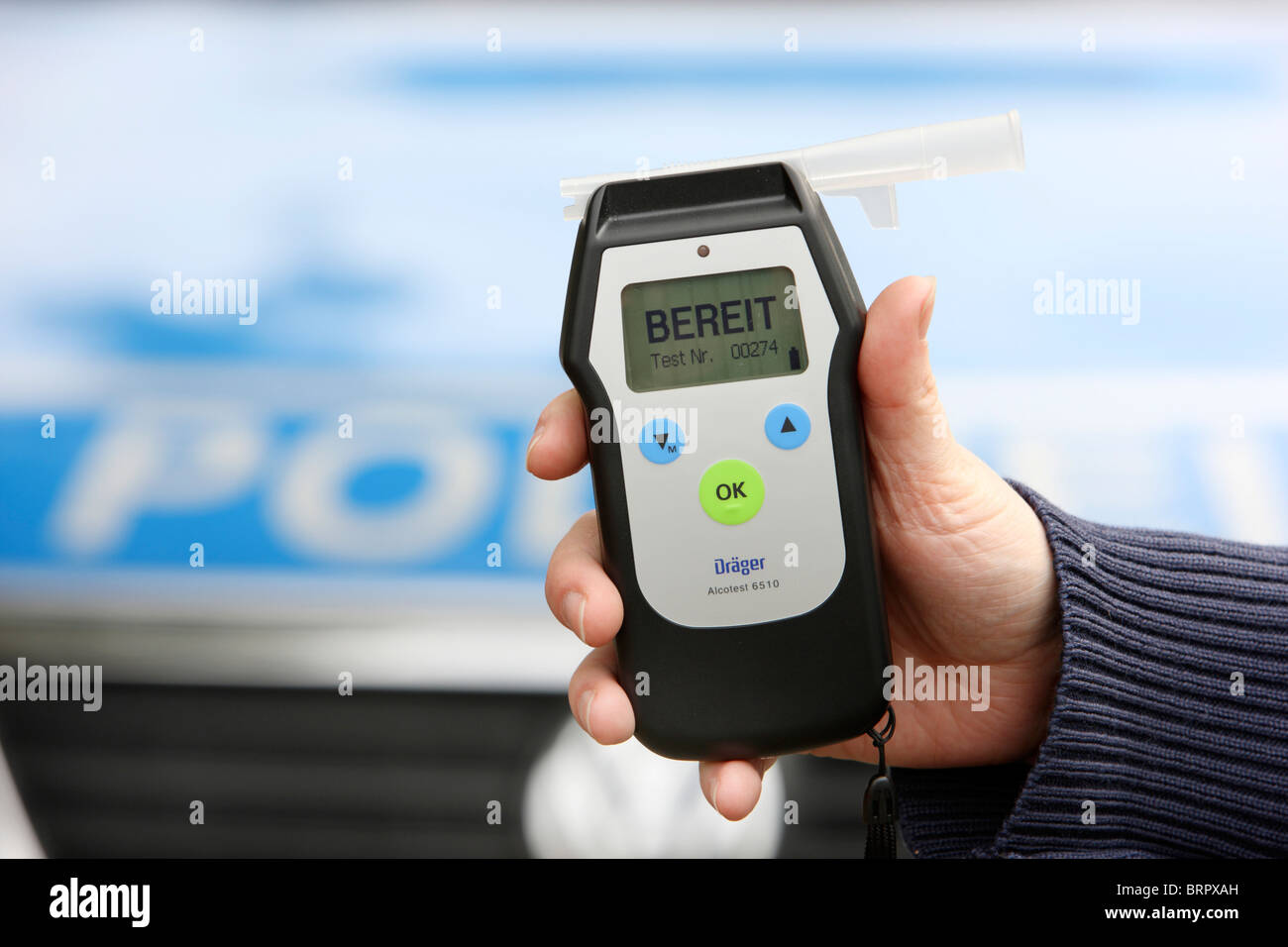 Alcohol test, breathalyser, Police officer shows the device. Stock Photo
