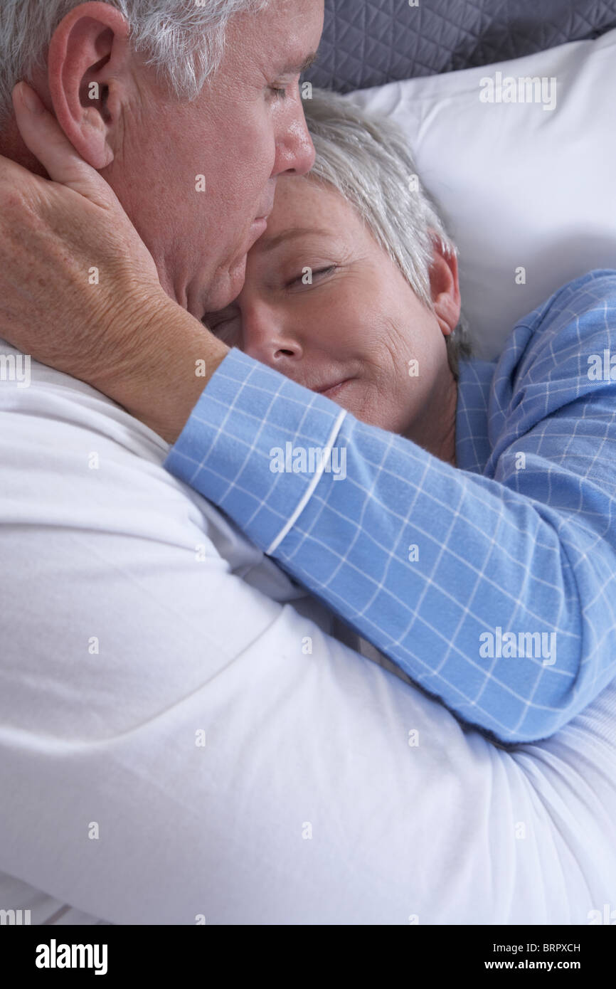 Couple embracing in bed eyes hi-res stock photography and images - Alamy