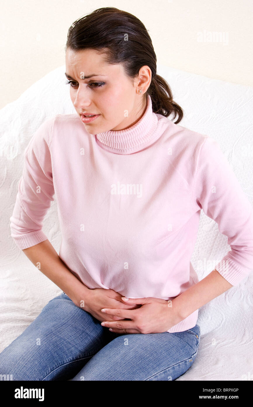 young woman with stomach cramps Stock Photo Alamy