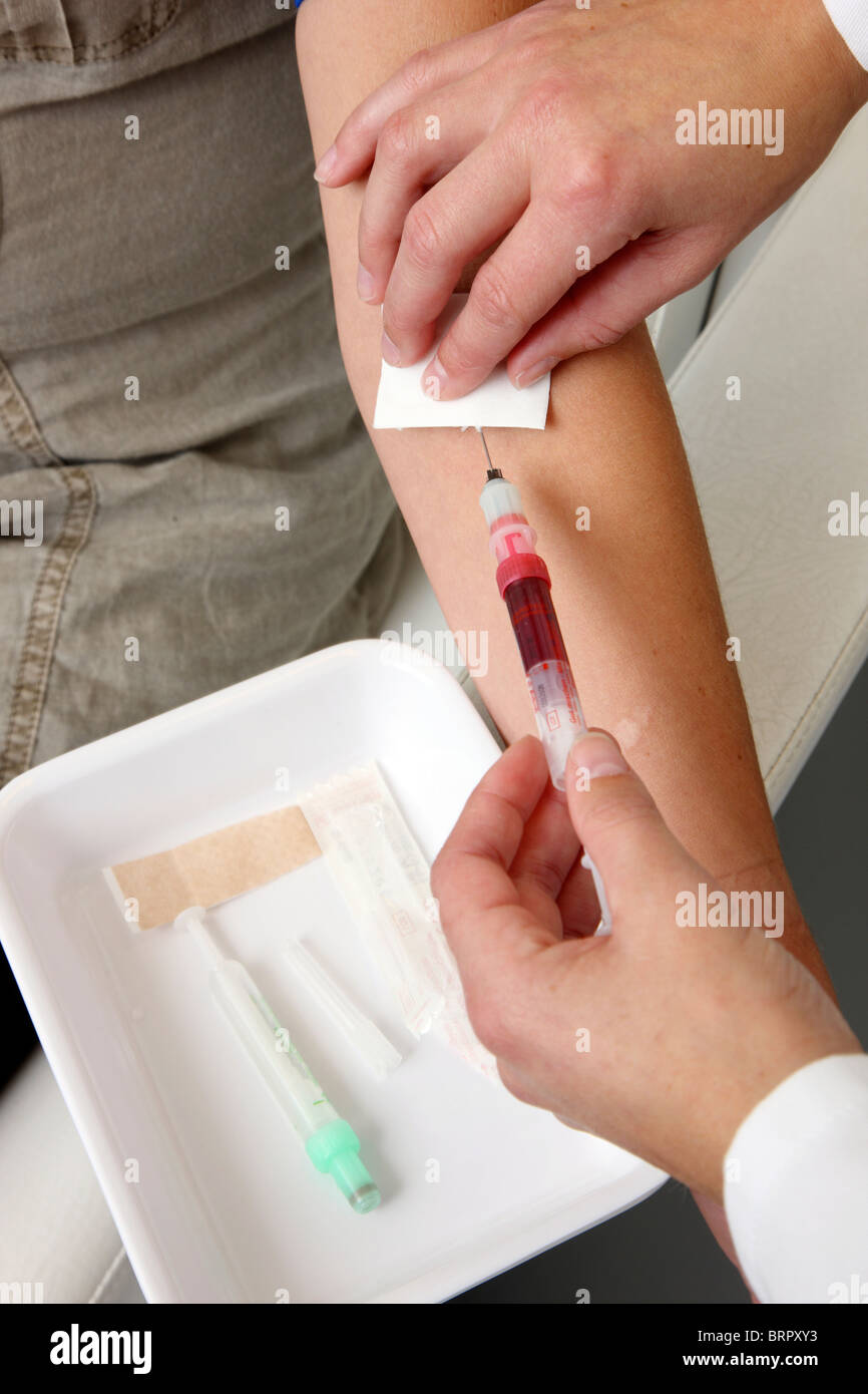 Medical practice. Doctors assistant taking a blood sample of a patient Stock Photo Alamy